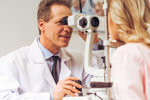 Eye doctor examining a patient