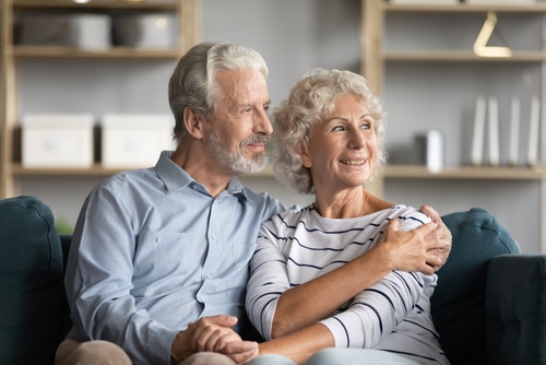 Happy senior couple relaxing at home